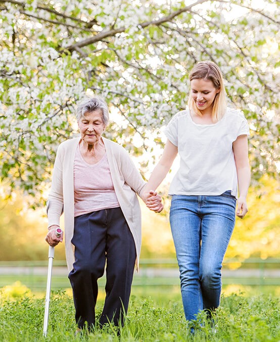 Home Caregiver in walking with senior lady outside in Williamsport PA