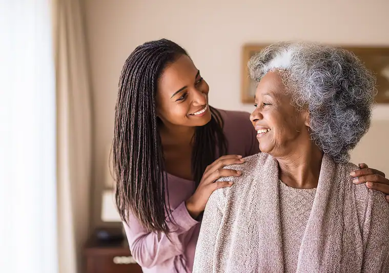 Woman caring for her elderly mother at home. Transfer home care and Medicaid waiver program in PA.